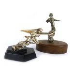 A mid 20th century Packard car mascot of chrome plated winged figure, fixed on a black wooden base,