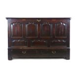 An early 18th century oak mule/marriage chest, the lift up top opening to reveal vacant interior,