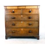 A George III oak chest of two short over three long drawers on shaped bracket feet. h. 111 cm, w.