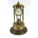 An early 20th century brass anniversary clock the movement with the mark of two elephants