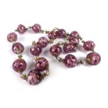 A single strand purple Murano glass bead necklace