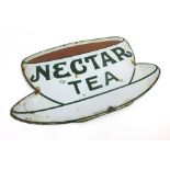 An enamel advertising sign for Nectar tea in the form of tea cup and saucer