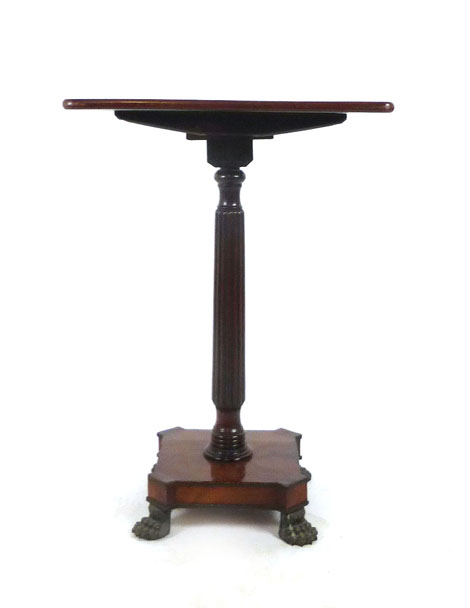 A regency and later mahogany tilt top occasional table, the rectangular top on reeded column,