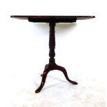 A Georgian mahogany rectangular topped tilt top table tripod table,