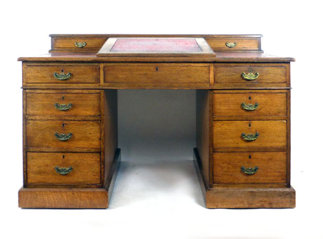 An early 20th century oak twin pedestal desk with writing slope to top with tooled red leather - Image 2 of 2