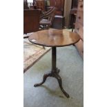 An 18th century oak and elm tripod table, the circular elm top on turned oak column. h. 69 cm, dia.