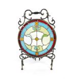 A cast metal and leaded light circular fire screen,