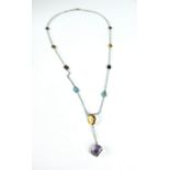 An 18ct white gold multi-coloured gemset pendant necklace, 6.