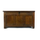 An early 18th century oak triple panelled coffer with nulling to front. h. 66 cm, w. 122 cm, d.