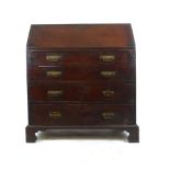 A George III mahogany bureau the fall front revealing a fitted interior over four graduated drawers