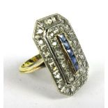 An 18ct yellow gold ring set thirty-eight brilliant cut diamonds and five princess cut sapphires in