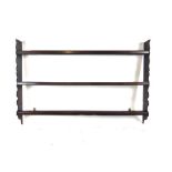 An 18th century plate rack with shaped sides. h. 92 cm, w. 140 cm, d.