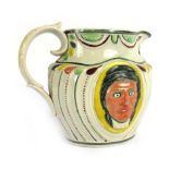 A late 18th century Pratt-ware jug relief decorated with two faces displaying contrasting emotions,