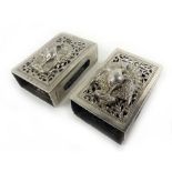 A pair of Burmese metalwares matchbox holders, each relief decorated with a peacock,