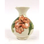 A Walter Moorcroft 1990 vase decorated in the anemone pattern on a cream ground, h. 13.