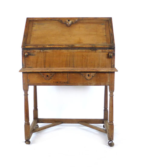 An early 18th century cedar wood bureau on stand,