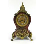 A French boule and gilt brass mantle clock with enameled Roman numerals to the face, h. 30 cm, w.