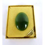 A cased 20th century jade brooch of oval form with a gilt metal clasp CONDITION REPORT: