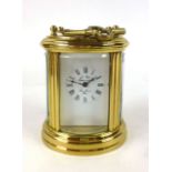 A French brass cased five glass oval carriage clock,