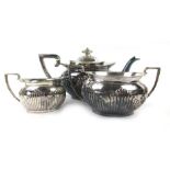 A silver three piece tea service of squat vase shaped form, maker BB, Sheffield 1922,