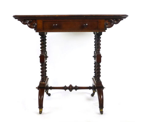 A Victorian walnut card table the swivel top action over single drawer on barley twist ends