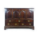 A mid 18th century oak mule chest later converted to a cabinet,