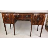 An early 19th century mahogany, tulipwood cross banded and boxwood strung sideboard,