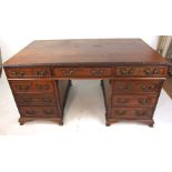 A 19th century mahogany partners desk in the 18th century style,