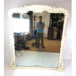 A 19th century French overmantle mirror with a cream painted Rocco frame, h. 169 cm, w.