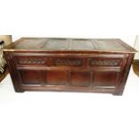 An 18th century and later oak panelled coffer,