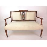 An Edwardian mahogany boxwood line inlaid and satinwood banded two seat settee upholstered in a