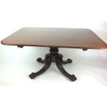 An early 19th century mahogany breakfast table,