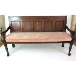 An 18th century oak settle,