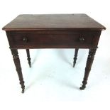 A George III mahogany single drawer writing table the top with lift up stationery flap on turned