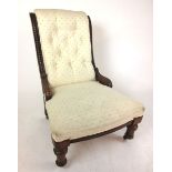 A Victorian mahogany bedroom chair upholstered in a cream button backed fabric on turned legs. h.