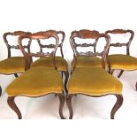 A set of six Victorian rosewood dining chairs,