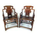 A pair of 19th century Chinese elm alter chairs,