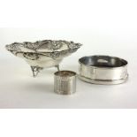 A silver bowl with shell form decoration on three feet, stamped 925, w.