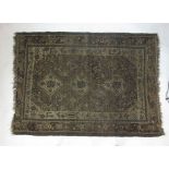 A hand woven Caucasian rug the multi lined border enclosing the central field with animal motifs