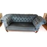 An Edwardian blue draylon button back upholstered drop end sofa on turned oak front legs, h.