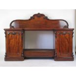 A Victorian mahogany sideboard the top over central drawer flanked by two cupboards,