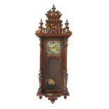 An early 20th century walnut and beech Vienna wall clock,