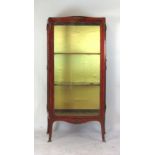 A 19th century French Kingwood and brass mounted display cabinet with glazed doors to either side,