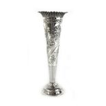 A Victorian silver vase, the engraved body of tapering form on a circular base, London 1892, h.