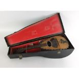 A cased mandolin bearing a label Michele Maratea & Figli,