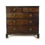 An early 19th century mahogany chest of two short over three long drawers on bracket feet. h.