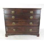 An 18th century oak chest of two short over three long drawers on bracket feet, h. 80 cm, w.