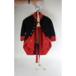A 19th century child's mascot uniform to include a navy and red jacket with Royal Artillery buttons,