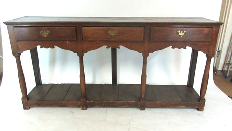 A 18th century and later oak dresser base,