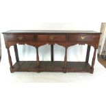 A 18th century and later oak dresser base,